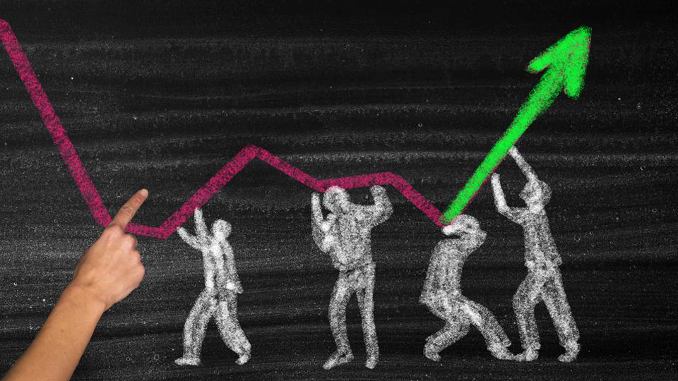 Chalkboard drawing of people holding up a graph